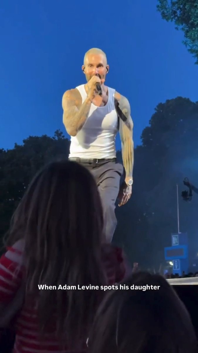 Adam Levine spotted his daughter while on stage, beelining to her as he performed to give her the sweetest kiss 💗 The Maroon 5 star's wife, Behati Prinsloo, held up his daughter so the pair could share the adorable moment, fans loving every second 💕 Adam, 47, and Behati, 38, share three children, Dusty Rose, 9, Gio Grace, 8, and a 3-year-old son. 📽️ : pinkwhitecoconutice, concerts.enthusiast #AdamLevine #FatherDaughter #Maroon5