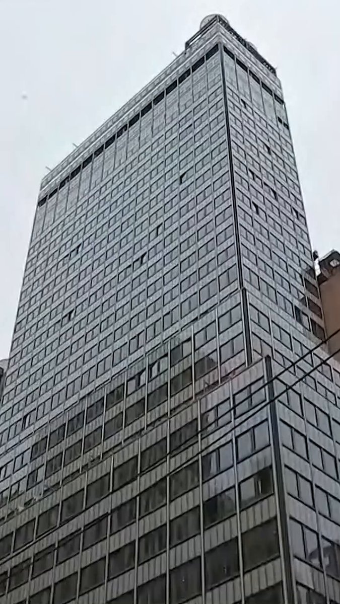 Construction crews were pulled from a 37-story Midtown Manhattan building Tuesday morning after bricks were reported falling from the 21st floor, emergency officials said, prompting building evacuations and street closures