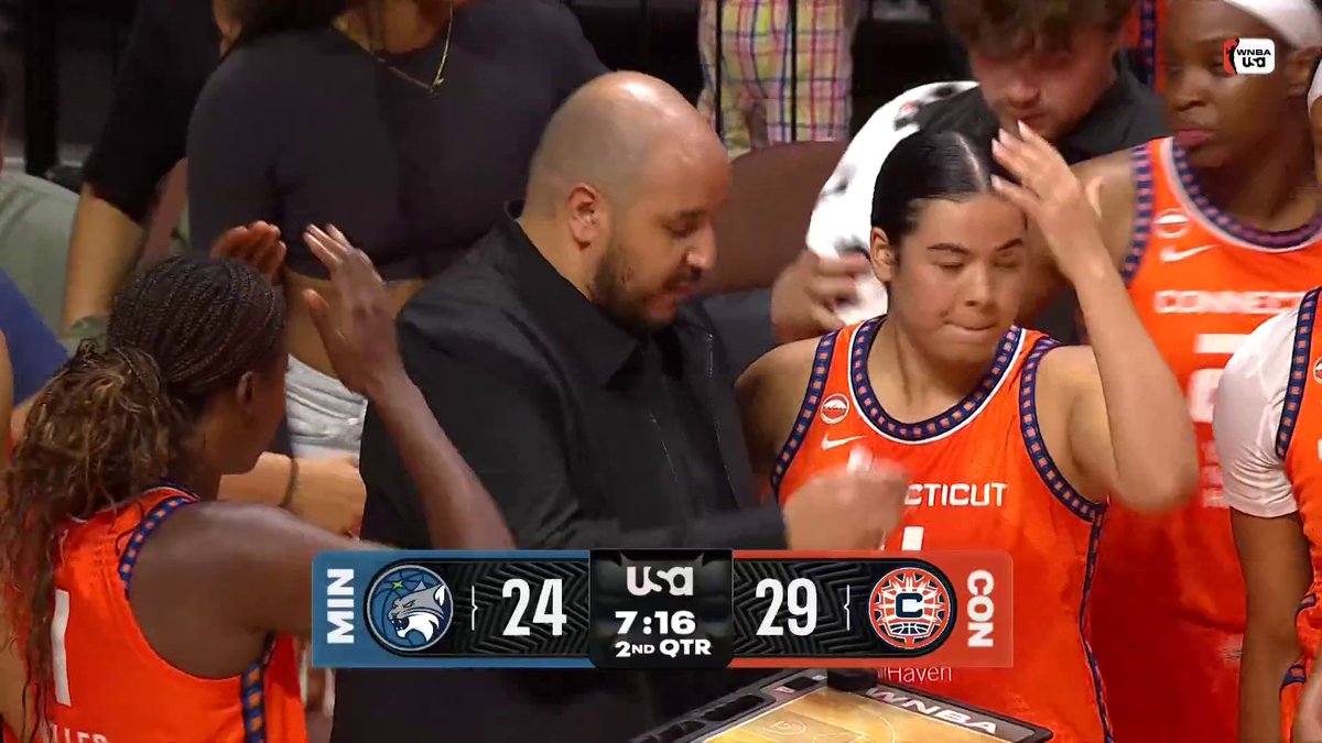 Saniya Rivers is wheelchaired to the locker room after a hard collision with Nia Coffey.
