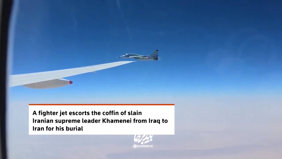 An Iranian air force fighter jet escorted a plane carrying the bodies of slain Iranian leader Ayatollah Ali Khamenei and his family members as it returned from a funeral ceremony in Iraq to Iran for burial