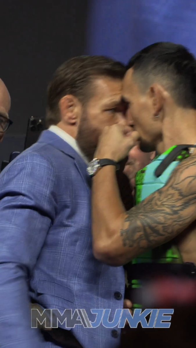 Conor McGregor and Max Holloway are restrained at an electric #UFC329 press conference faceoff.