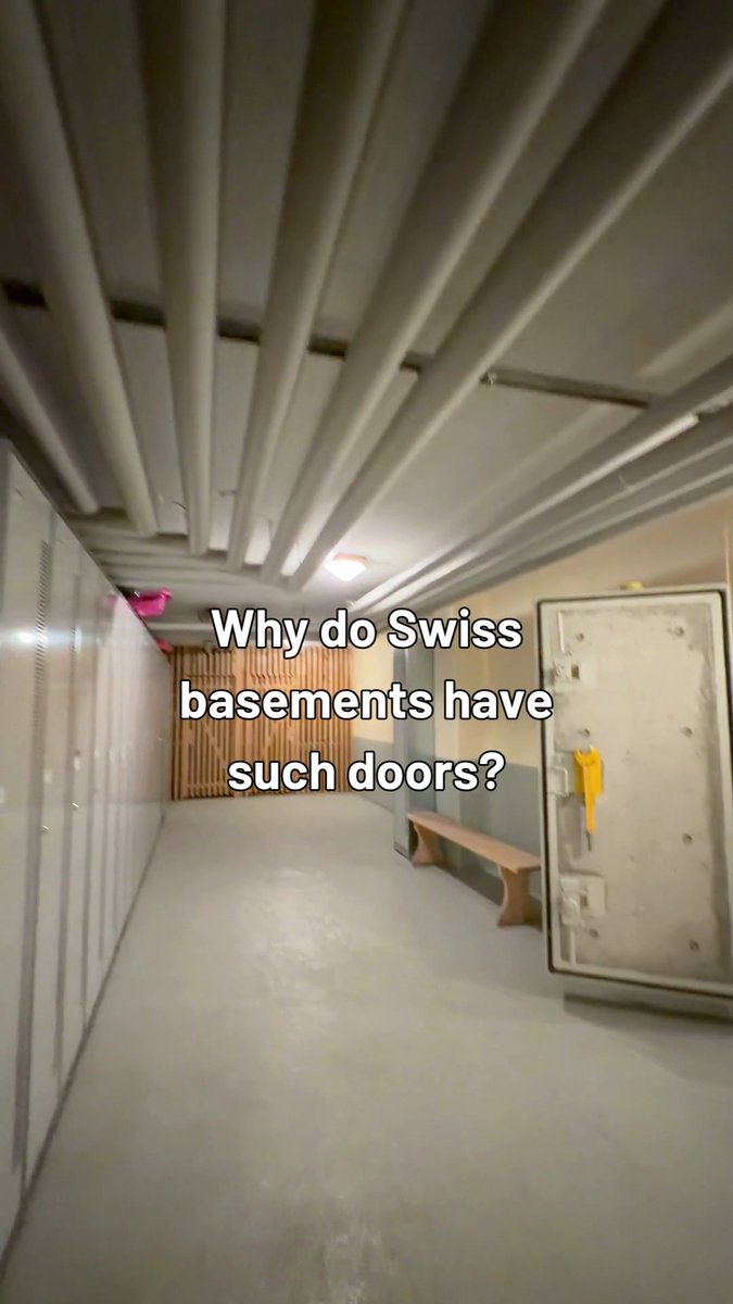 In Switzerland, many basements hide more than storage rooms. 🇨🇭🚪 The country has around 9 million shelter places in about 370,000 private and public shelters. Many are built underground and used in everyday life as cellars or storage rooms, but can be prepared for civil protection use if needed. Would you expect to find this behind a basement door?