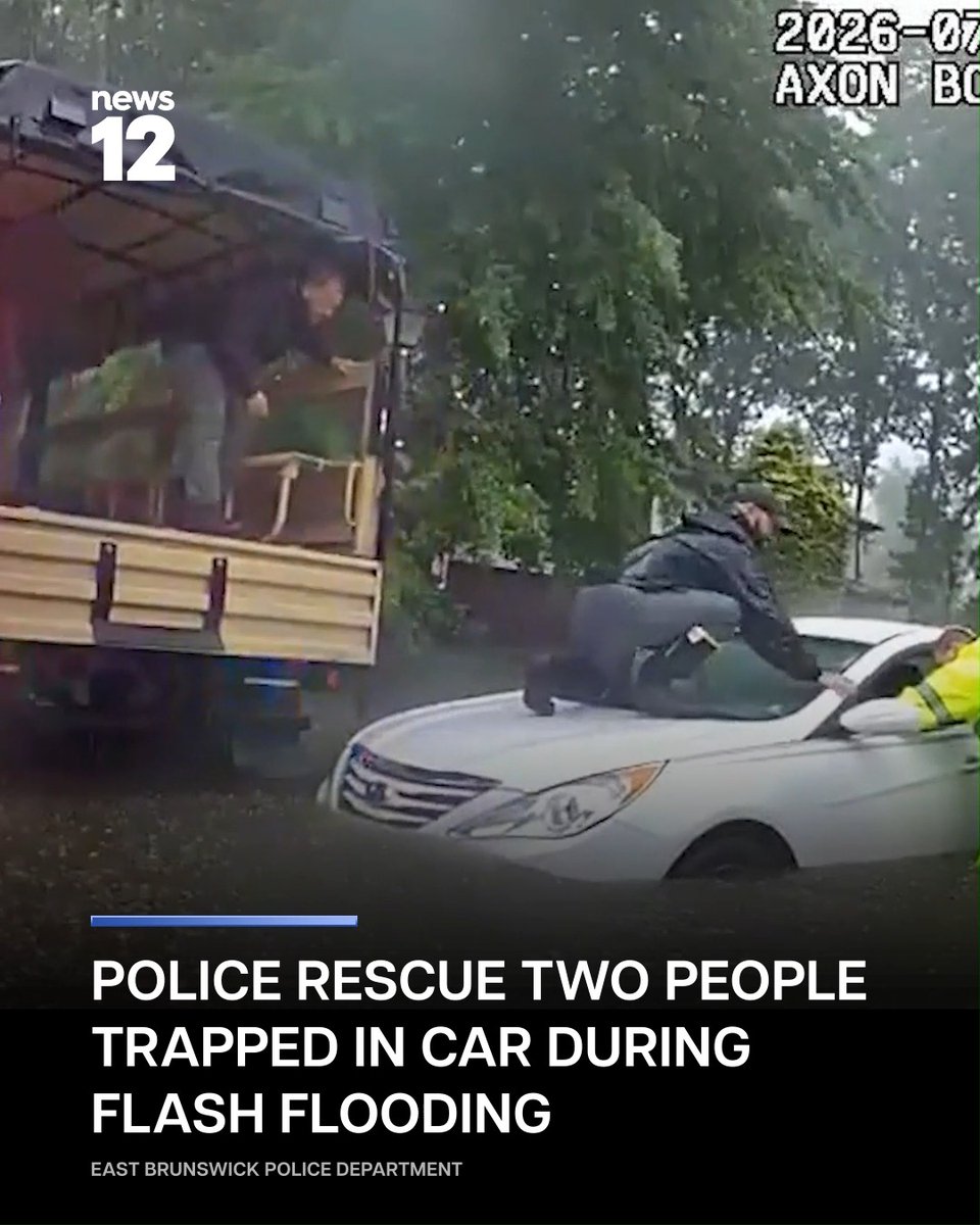DRAMATIC RESCUE: Video shows #EastBrunswick police officers wading through knee-deep water to rescue the occupants after the vehicle lost power. -