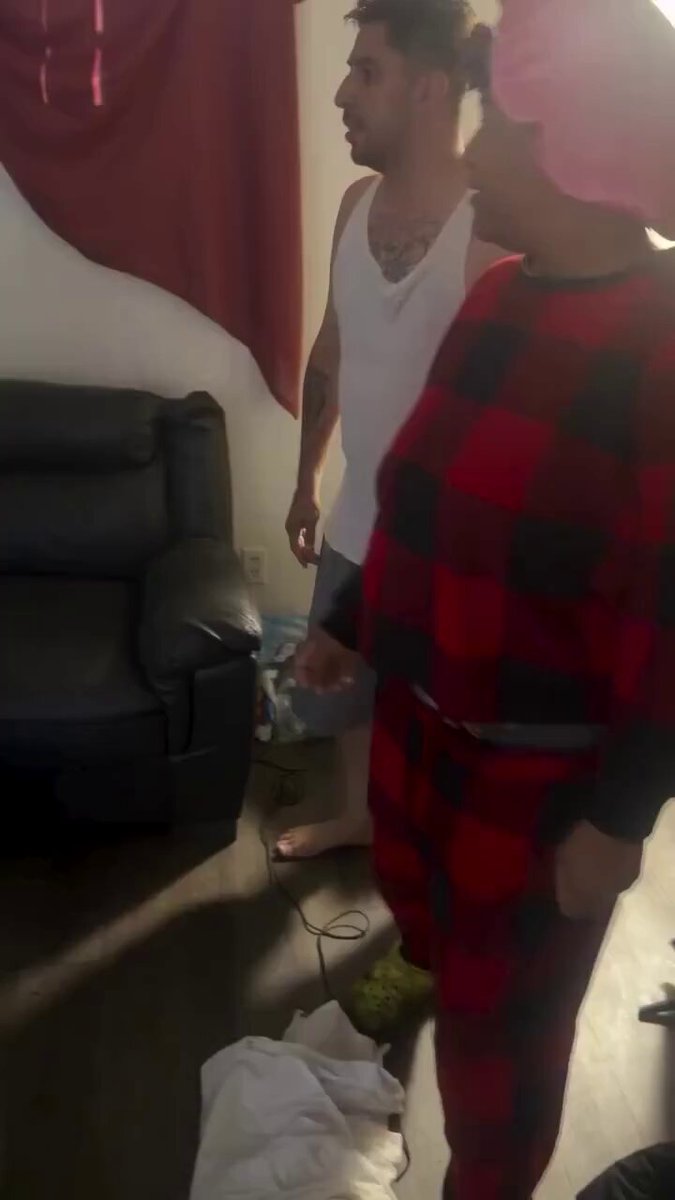 Shirtless guy in tank top wrestles another dude on the couch arguing over who swung first and phone hits while they grapple and roll around. Pure unfiltered chaos as tensions explode in the living room. Family beefs always get real. Whats the craziest fight you've witnessed or been in? #FamilyFight #CouchBrawl #RealDrama