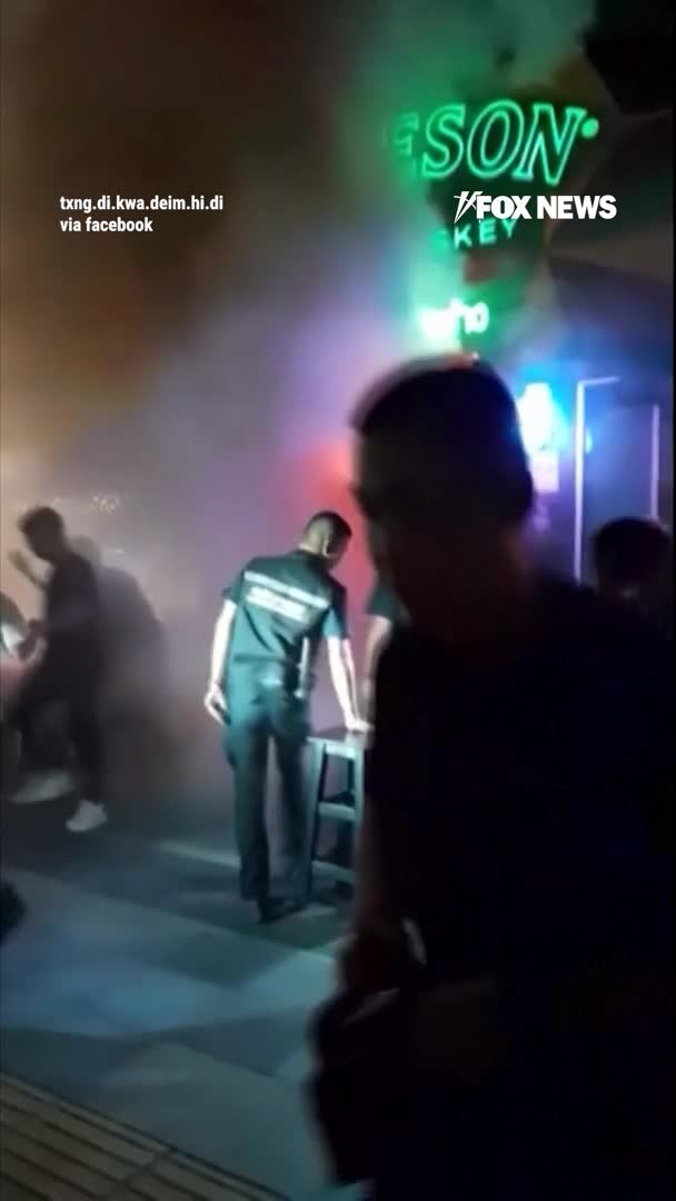 Eyewitness video shows flames pouring out the entrance of a packed Bangkok pub as people scramble to escape the deadly fire. Officials say at least 27 people have been killed and dozens more are injured, including 22 in critical condition, after the fire broke out just before midnight Sunday and quickly filled the venue with smoke. Survivors say many people panicked and ran toward the back of the pub near the bathrooms because there were no fire exits inside the venue.