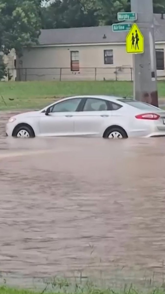 Video from Bossier City, Louisiana, shows vehicles driving through flooded streets, with some getting stuck.