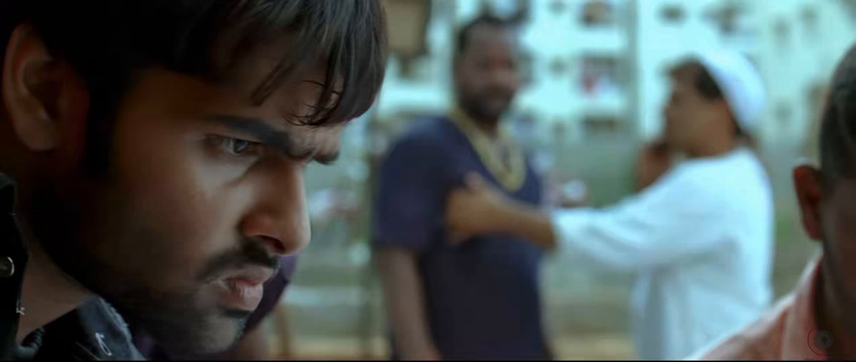 ram striking a red coin (highest value in carroms) to manikyam anna (highest rowdy in his village) coming out of a red car who ram essentially strikes as well. peak detailing by sukku.