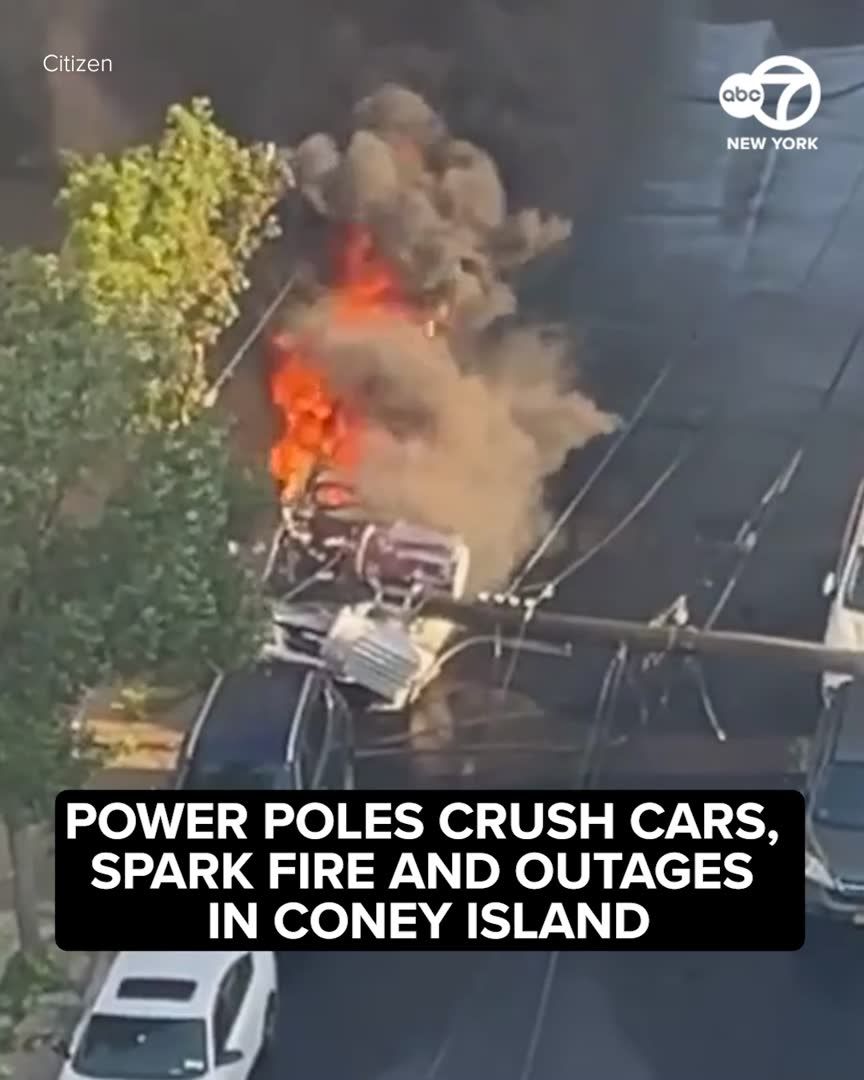 Two utility poles collapsed onto parked cars in Coney Island, Brooklyn, on Wednesday morning, sparking a fire, crushing several vehicles and leaving hundreds without power.