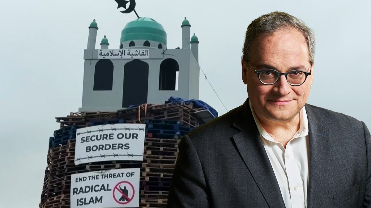 🇮🇪 Man jailed in Northern Ireland for burning fake mosque in bonfire Brian Conrad Neil, 56, was arrested, refused bail, and was charged with incitement to hatred after a model mosque was placed on a bonfire as part of a tradition where no religion, ethnic group, or head of state has historically been spared. Bonfire season in Northern Ireland is a centuries-old tradition. Enormous towers of wooden pallets, decorated with the symbols of whoever you oppose, lit on fire at night. Catholics burn Union Jacks and pictures of the King. Protestants burn Irish tricolours. Politicians, royals, and foreign flags all get their turn. Jewish symbols have appeared on bonfires. So have Israeli flags. It is, Ezra Levant noted on Monday's episode of The Ezra Levant Show, essentially a free-speech zone that has existed for hundreds of years. This year, a bonfire in Moygashel, County Tyrone displayed a replica mosque. The words on it read: "Secure our borders. End the threat of radical Islam." The Arabic lettering, Ezra noted, referenced fascism — a deliberate attempt to distinguish radical Islam from the broader religion. The man who built it is now in jail. Brian Conrad Neil, 56, was arrested, refused bail, and appeared in the dock of Dungannon Magistrates' Court in handcuffs. He has been charged with incitement to hatred. District Judge Barney McElholm declared that those who placed the replica mosque on the bonfire had "an agenda full of hate and bigotry towards others." The bail refusal was particularly striking to Ezra. "Everyone gets bail, especially in Ireland," he said. "Accused murderers sometimes get bail — but not a lad who put a fake mosque on a bonfire." The two reasons to deny bail, he noted, are flight risk and ongoing danger to the community. Neither applies to a man who built a parade float. The double standard is hard to miss. Just last month, a Sudanese migrant in Northern Ireland attempted to behead a man in the street. That attack triggered full-blown riots. The perpetrator was not refused bail. But a man who placed a model mosque on a bonfire — in a tradition where no religion, ethnic group, or head of state has historically been spared — sits in a cell. "No one is immune from the mockery on these bonfires," Ezra said, "except Islam. And a man sits in jail for a month because of it." He drew a parallel to Canada — where the Lord's Prayer was purged from Saskatchewan schools as offensive to non-believers, while a Muslim call to prayer is now broadcast over loudspeakers in downtown Regina. "Lord's prayer illegal," he said. "Muhammad's prayer is mandatory." "Be prepared to have your religion pricked," he said. "Unless, of course, you're Muslim."