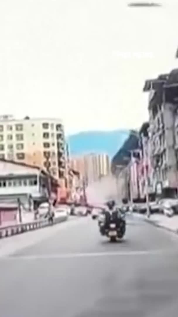 Video captures the terrifying moment an entire hillside suddenly gives way in Chongqing, China, sending tons of dirt and debris crashing into homes, businesses and a nearby road as people and drivers scramble to escape. State media says an unknown number of people were buried after multiple residential buildings collapsed. Authorities are still investigating what caused the landslide.