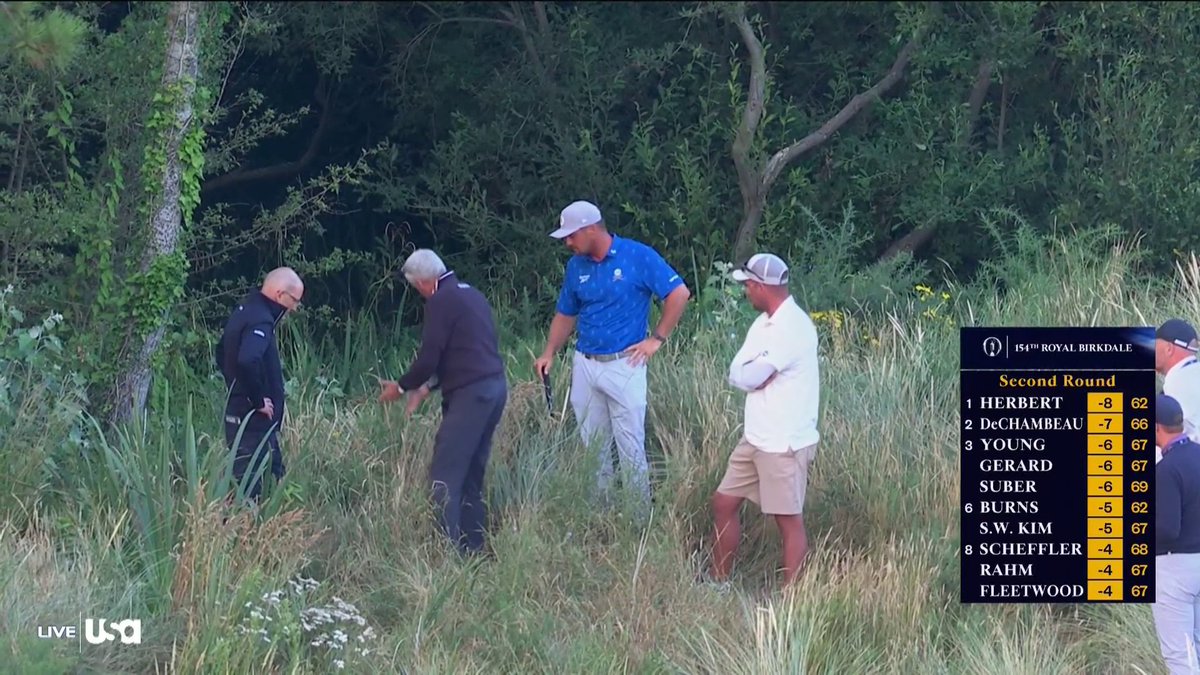 Bryson DeChambeau on the 5th hole with rules officials discussing the matter of trampled grass for an improved lie ⬇️