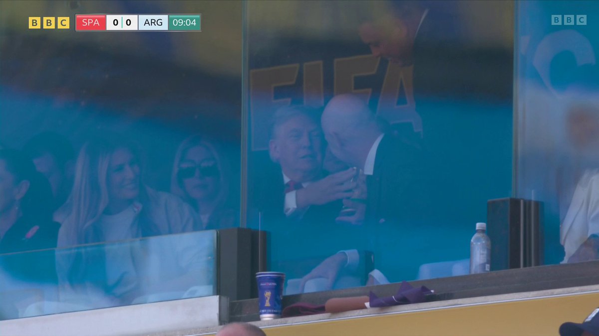 United States president Donald Trump gets his hands on the World Cup trophy - he's watching the final alongside Fifa president Gianni Infantino.