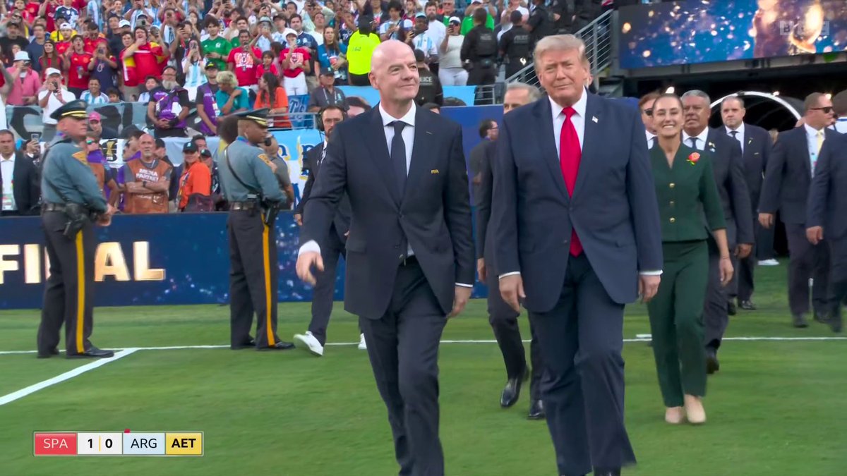 US President Donald Trump and Fifa President Gianni Infantino arrive on the field ahead of the presentation of the World Cup trophy.
