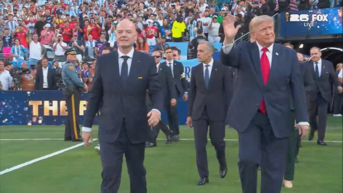 Audience boos drown out the music as Trump walks on to present the FIFA World Cup trophy