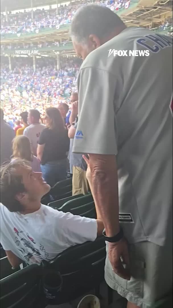 A tense moment at Wrigley Field turns physical when an older Cubs fan slaps a younger fan who refused to stand up during the national anthem. The older fan is heard telling him to "stand up" before striking him in the back of the head. The younger fan then stands as nearby spectators react. Authorities have not announced whether charges will be filed.