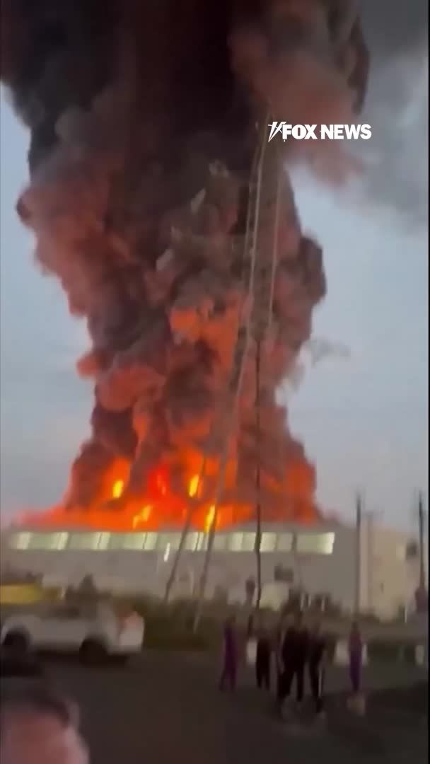 A massive fire erupts at a Wildberries warehouse in Russia following what officials describe as a Ukrainian drone attack. Eyewitness footage captures flames tearing through the logistics facility in Nevinnomyssk as smoke billows across the area. Regional officials say the drone strike ignited the warehouse complex, and Wildberries says two of its logistics centers came under attack.