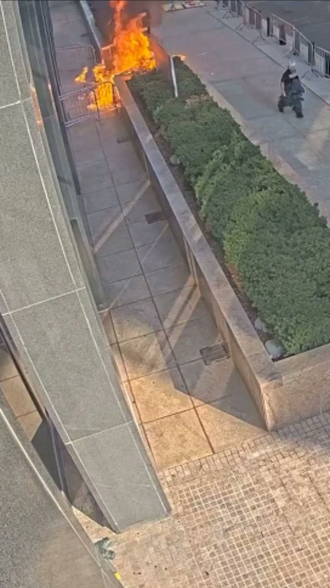 Surveillance footage released by the U.S. Attorney's office shows how a former U.S. Army soldier Andrew Arrabaca set off fireworks, started a fire and shot a pellet gun outside a Manhattan federal office building before he was subdued Monday morning.