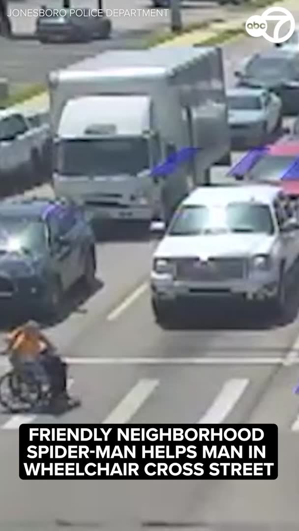 A driver dressed as Spider-Man stopped at a busy intersection in Jonesboro, Arkansas, and jumped out of his car to help a man in a wheelchair safely cross the street.