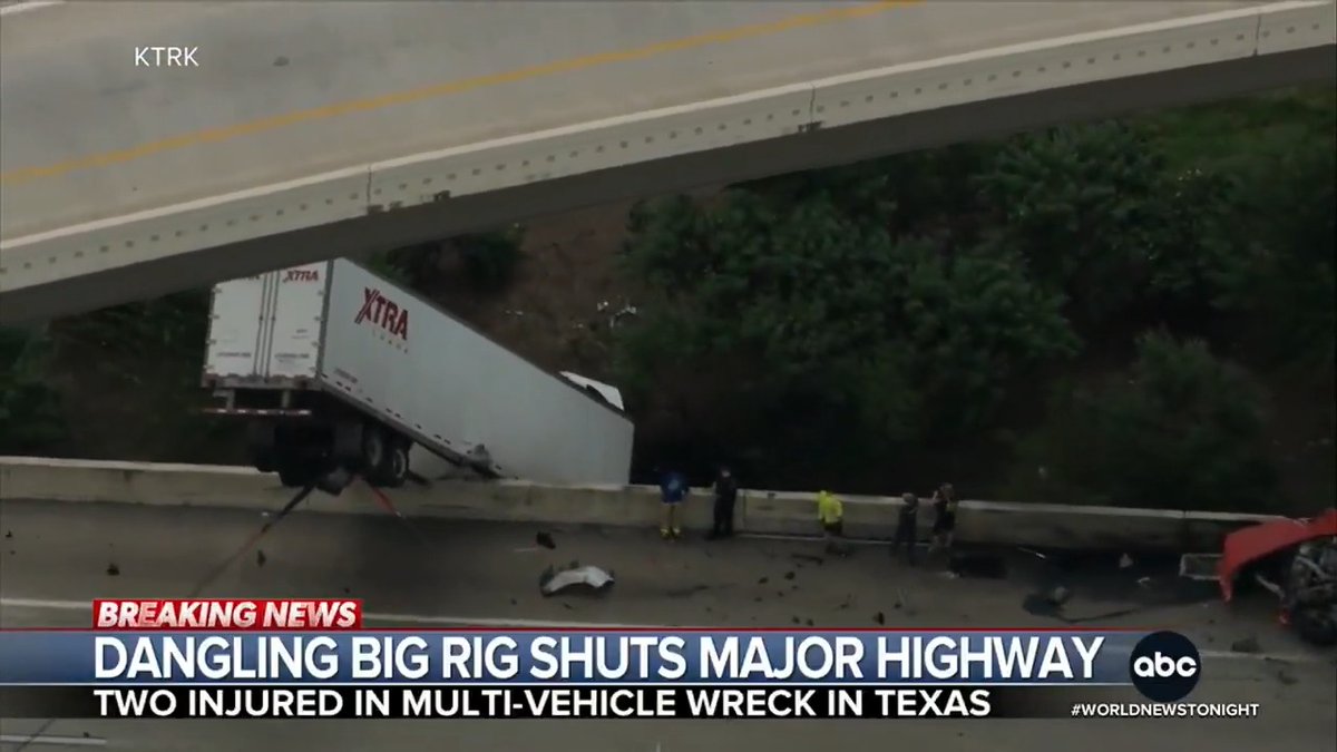 A multi-vehicle crash outside Houston sent a tractor trailer plunging off a major highway – leaving it dangling over the edge and nearly vertical in the air. The cab slammed to the ground below, but the driver luckily survived. Trevor Ault has details.