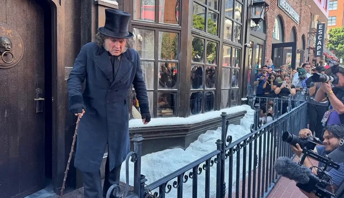 Johnny Depp Fully Transforms as Ebenezer Scrooge in Surprise Comic-Con Appearance Amazing transformation as usual for Depp as he fully throws himself into yet another iconic role. The actor showed up unannounced on the streets of San Diego in full old-age makeup and costume as the classic Dickens character, standing outside a Scrooge and Marley pop-up shop. Fans quickly gathered once word spread. He later appeared in Hall H to debut the trailer for his new film Ebenezer, which opens with the line “It’s good to be back.” Staying completely in character when a fan called out “Good day to you, Mr. Scrooge,” Depp shot back, “What’s so good about it?” (Video: AI) Directed by Ti West and due in theaters November 13, the film also features Ian McKellen, Rupert Grint, and Andrea Riseborough. Depp’s commitment to the look and performance once again proves why few can disappear into a role quite like him.