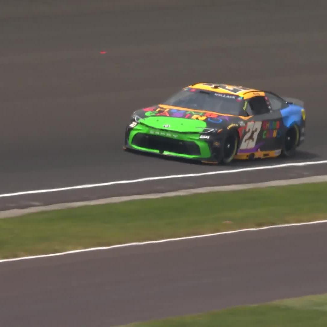 Bubba Wallace makes early contact with the wall in practice.