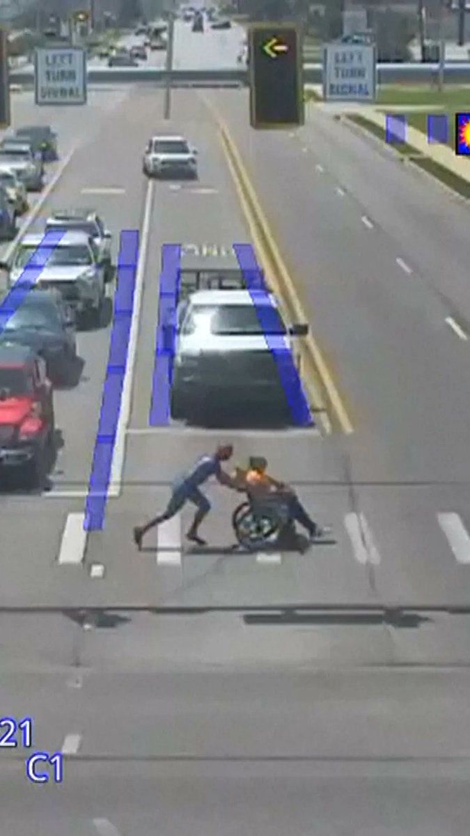 A man using a wheelchair was struggling to get across six lanes of traffic when help came in an unexpected way — Christopher Hellenthal, dressed as Spider-Man, ran out to help, declaring: “I got you.”