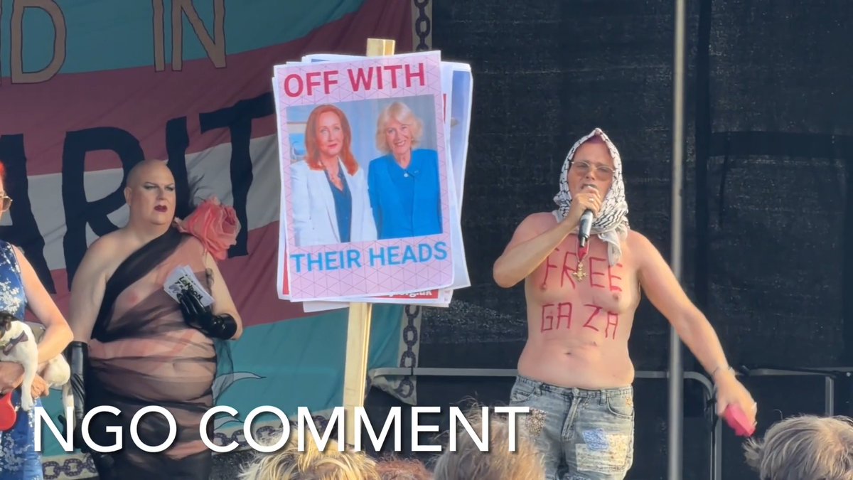 Trans activist Sarah Jane Baker, who served years in prison for attempted m—rder and kidnapping and torture, was one of the speakers at the London Trans Pride today in Trafalgar Square. One of the trans activists held a sign declaring “OFF WITH THEIR HEADS” and the photo of J.K. Rowling and the Queen.