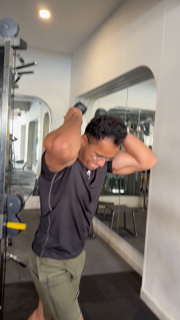 Your triceps will never be maxed out if all you do is pressdowns. Train them overhead. That position loads the long head at longer muscle lengths — exactly where hypertrophy stimulus can be especially potent. Pressdowns are good. Overhead extensions are non-negotiable.