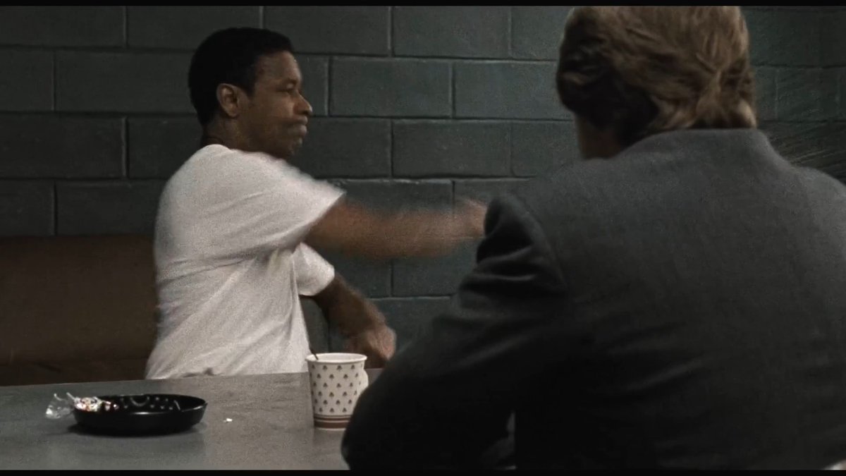 In the final scene between Denzel Washington and Russell Crowe in American Gangster, the moment when Denzel swats his coffee cup across the table was completely improvised. Russell Crowe then responded with his own subtle piece of improvisation. Ridley Scott explains: “That just happened. Denzel swatted the coffee off the table. It comes off Richie’s line, "And everything can return to normal." Denzel starts to talk about what he means by "normal", and he literally lost it; he got enraged and swatted the coffee. I thought that was pretty cool, so I just let it run. It’s only going to happen once; you can’t predesign these things. If it happens, it happens, and that’s great because you know it’s real. Then Russell, during the right moment, decided during the take – because I was running four cameras on them – to push the coffee back as is to say, "The ball’s in your court." Denzel didn’t immediately use that. I was waiting for him to slide it back. And then he chose the right moment to slide it back. That all happened spur of the moment.” Quote comes from an interview with Jeremy Smith. Oct, 2007