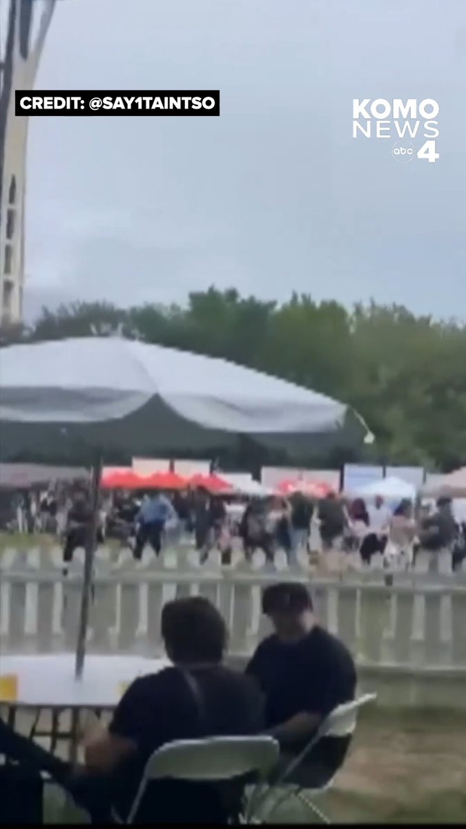 Video shared with KOMO News shows the immediate aftermath of the mass shooting at the Bite of Seattle event in Seattle Center on Sunday. People are seen panicking and scattering in all directions around the International Fountain, even breaking a plastic fence to get away, after reportedly dozens of rounds were fired between two people at one another, hitting innocent bystanders. Three people were killed and four others hurt, including a toddler. Police say a 15-year-old suspect has been detained for investigation of first-degree assault and firearms violations, and they are working to identify a second suspect. Credit: @ say1taintso via Instagram MORE: