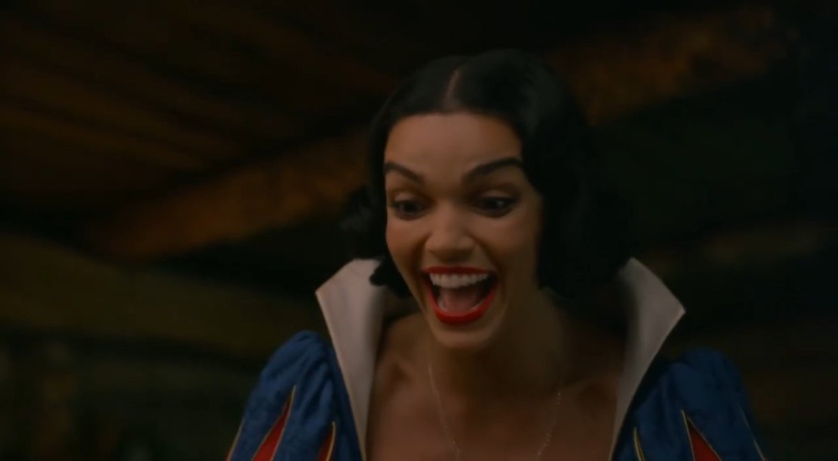Snow White deleted scene 😂 It’s so refreshing that you can now generate a video for up to 20 seconds using Flux 3! Prompt: Handheld shaky camera, 20 seconds, dark comedy tone. Snow White in classic dress stands in the forest cottage, smiling sweetly as she hands poisoned red apples to the seven dwarfs one by one. The dwarfs eagerly bite into the apples. One by one they freeze, eyes roll back, and collapse hard onto the wooden floor in a messy pile — bodies twitching then going completely still. Camera quickly pans and zooms in handheld style onto Snow White’s face. She breaks into uncontrollable, maniacal laughter, head thrown back, eyes wide with pure evil delight, laughing harder and harder while looking down at the fallen dwarfs. Low key lighting, slight film grain, continuous handheld shake throughout. No dialogue, only the sound of her escalating laughter.