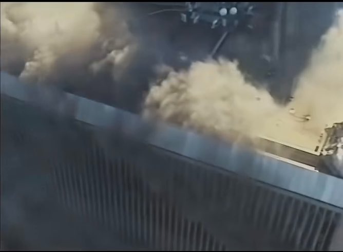 September 11, 2001 : One of the closest camera footages ever captured of the World Trade Center. An NYPD helicopter flies over the North Tower while considering a rooftop evacuation.