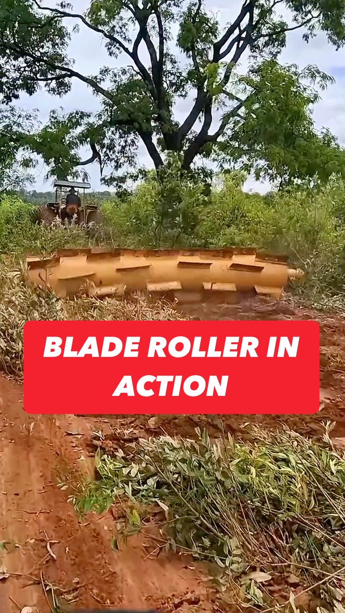 Blade roller in action. The heavy drum and sharp blades cut and level the surface with steady, powerful passes.