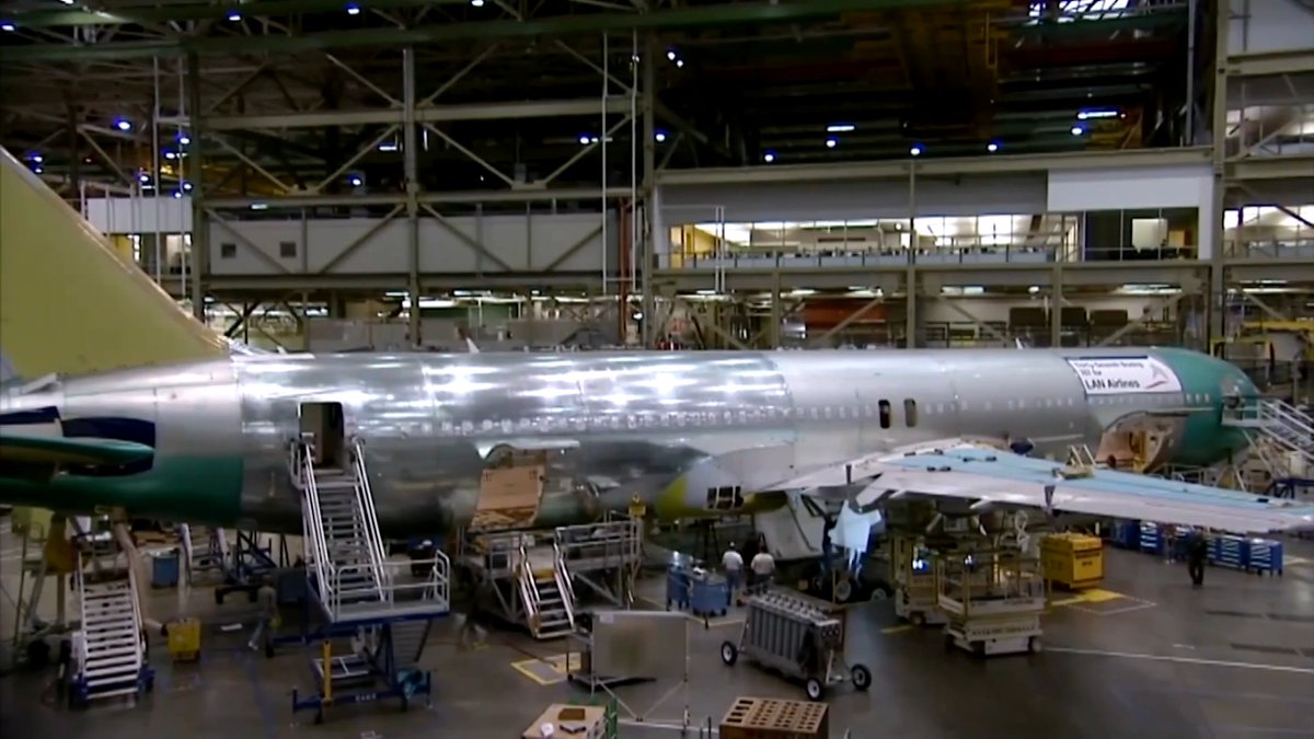 Boeing reported a larger-than-expected quarterly loss after taking a $280 million charge on its troubled Air Force One replacement program, but generated positive free cash flow as its turnaround plans gained momentum