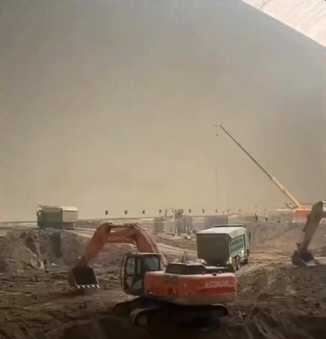 How massive inflatable construction domes protect large building sites in China.