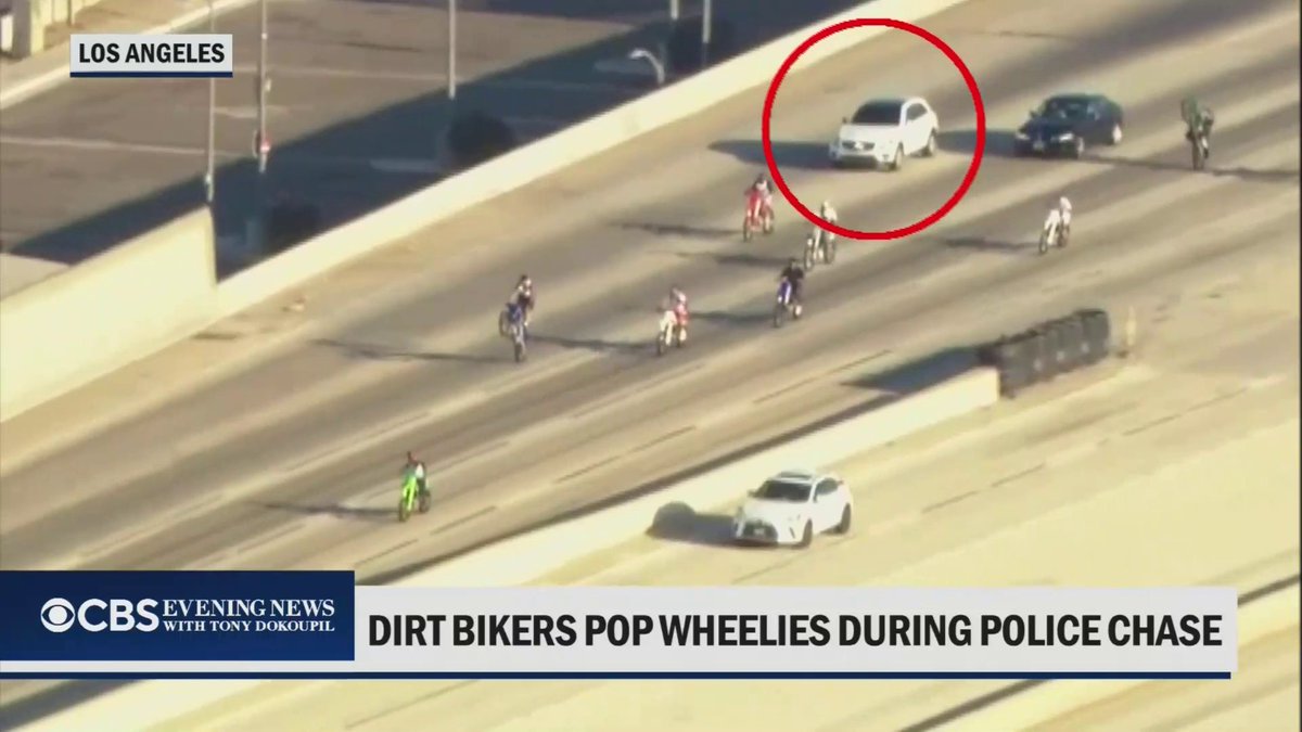 The driver of a stolen SUV leading police on a high-speed chase through Los Angeles narrowly avoided crashing into a group of dirt bike riders on the 101 Freeway.