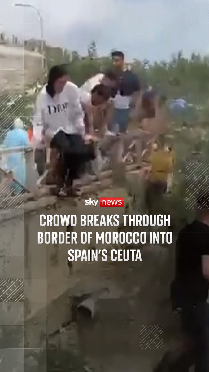 Authorities in Ceuta have asked for the government in Madrid to declare a national emergency and requested army intervention, as thousands crossed into the tiny Spanish territory. Footage filmed at Tarajal beach shows a crowd of people walking around the breakwaters and running on the beach and roads. 🔗