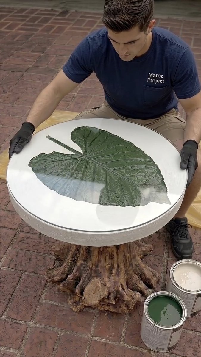 I made my own side table from concrete and wood with a taro leaf vein motif