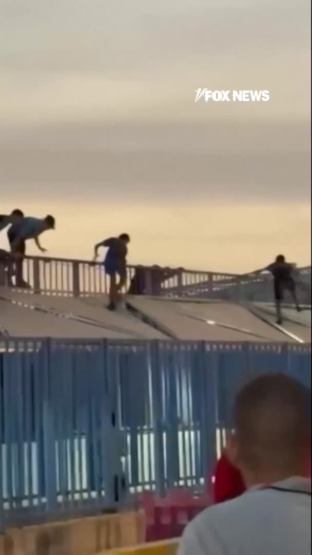 Chaos broke out along the Morocco/Spain border in Melilla as migrants surged through the Beni Ansar crossing. Eyewitness video shows people climbing onto border structures and flooding into the crossing complex. The scenes come as Spain rushes military units to nearby Ceuta, where hundreds of migrants also attempted to enter by sea and land as authorities work with Morocco to regain control of both borders.
