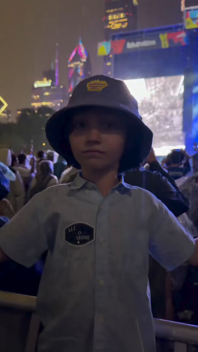Couldn’t help but share. My son Augustus when the rain started coming down during Tonight Tonight. What a charmer. Lollapalooza