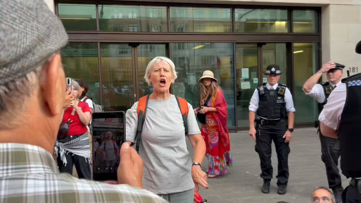 AMAZING MOMENT A woman came back still wearing a custody tshirt having been released for a terrorism arrest. While being arrested for declaring support for Palestine Action a second time, another woman came back to do the same. The opposition to this ban cannot be contained.