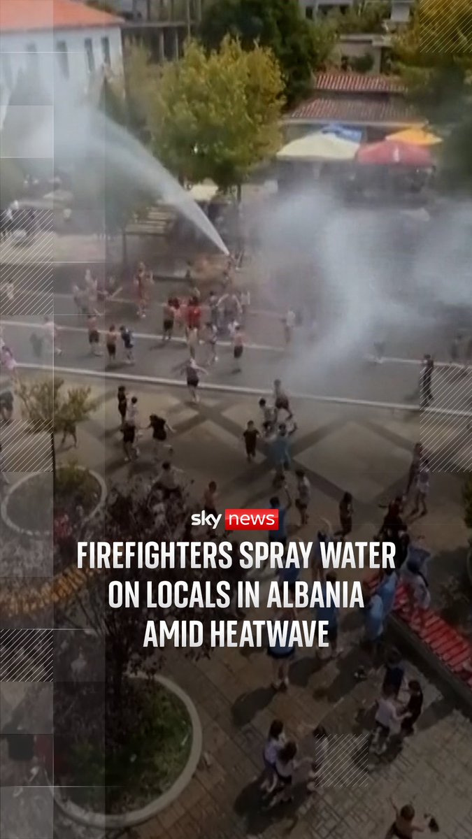 Fire engines in Gramsh, Albania, drove through the streets spraying locals with water as temperatures in the city reached 38 degrees.