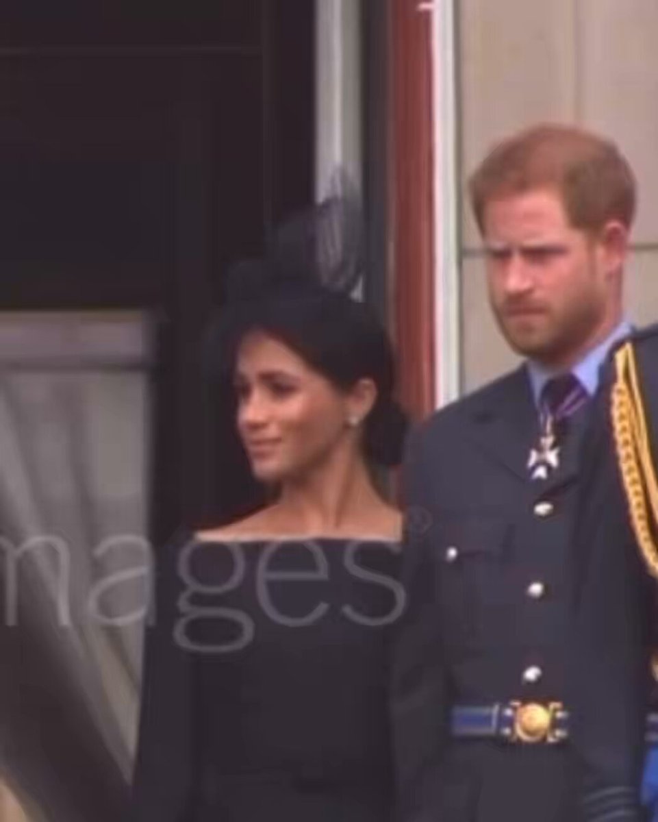 #MeghanMarkle mask slip on the balcony after the RAF Centenary. Harry *always looks confused and perplexed, so that’s normal. #HarryandMeghan #MeghanIsTheProblem