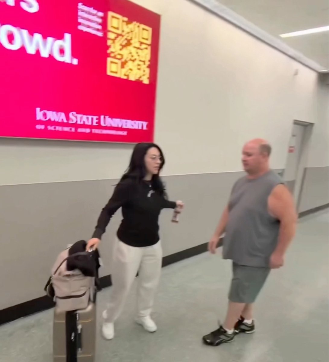 Stephanie Vaquer being hounded at the airport by autograph scalpers as she tries to exit: