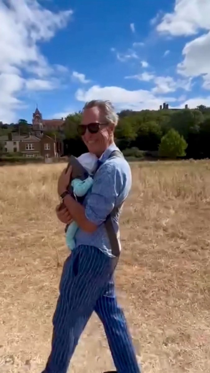 Richard E. Grant is so very happy to be a grandpa 🥹 The 69-year-old actor shared heart-melting videos of himself taking a stroll with his newborn grandson in a baby carrier, calling it "a pouch full of pure happiness" ❤️👶 The little one's arrival comes nearly five years after the loss of Richard's beloved wife, Joan Washington, making this new chapter all the more poignant. "How do I begin to thank our daughter [Olivia] and her husband for the greatest gift anyone could wish for?" he wrote 😭 📽️: richard.e.grant #grandpa #familymoments