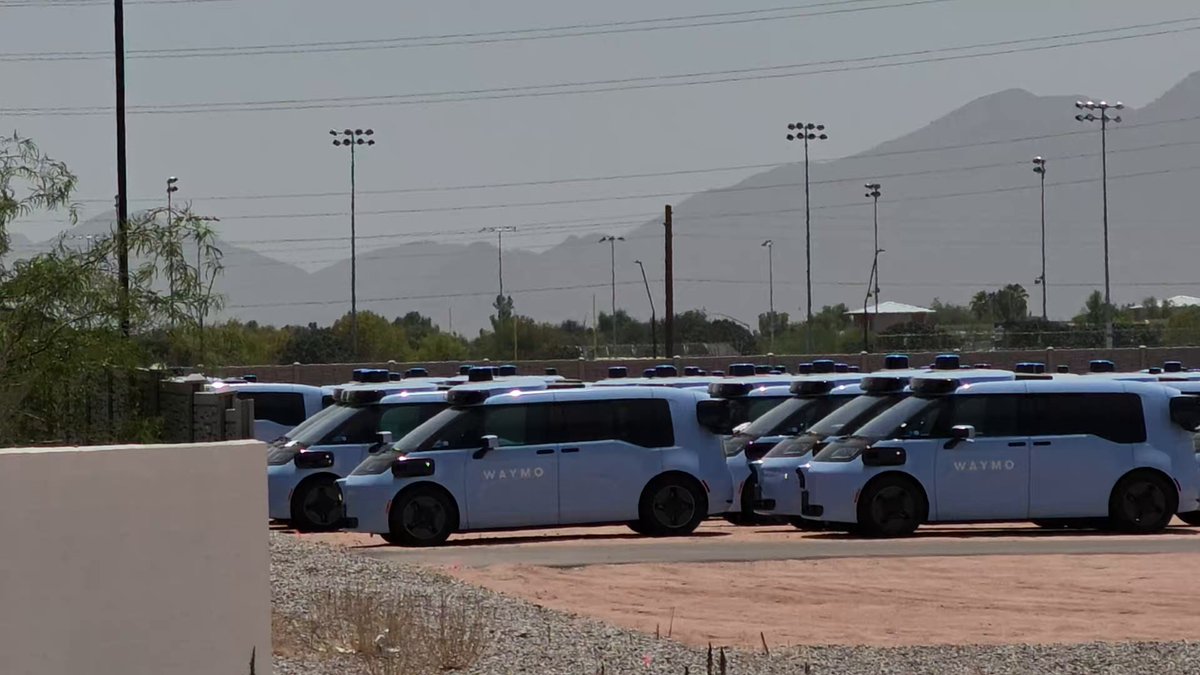 Just spotted upwards of 500 yes 500 Waymo Ojai today in Mesa, AZ These are produced by Chinese automaker Zeekr of the Geely holding group then retrofitted with Sensors by Magna I don’t know the exact number of cars just want to stress the magnitude of what I saw & the fact the lot went further than my eyes could see