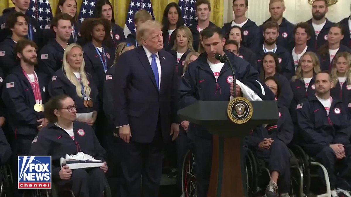 Team USA's Olympic and Paralympic flag bearers presented President Trump with a Team USA jacket and a pair of Team USA sneakers during a White House celebration honoring the athletes. On behalf of Team USA, Frank Del Duca and six-time Paralympian Lauri Stevens thanked Trump for supporting America's Olympic and Paralympic athletes before presenting him with the gifts, saying, "We hope you'll wear them proudly as you continue to cheer on Team USA."