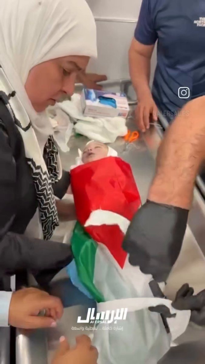 A newborn Palestinian, murdered by Jewish supremacists, wrapped in the Palestinian flag. Even our babies carry Palestine with them. This is how fierce our attachment is; the flag stays with us in life and in death.