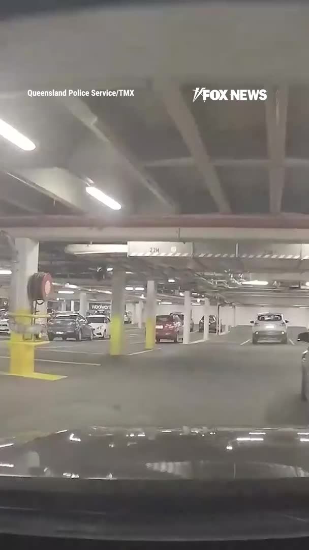 Striking dashcam footage shows a police officer weaving through a shopping mall parking garage while chasing down a suspect. Police say the driver abandoned a Mercedes and fled on foot after officers observed him driving dangerously at high speeds, while a female passenger allegedly took the wheel and continued driving until officers stopped the vehicle with a tire-deflation device. The man now faces nine charges, including two counts of unlawful use of a motor vehicle, while the woman has been charged with dangerous driving.