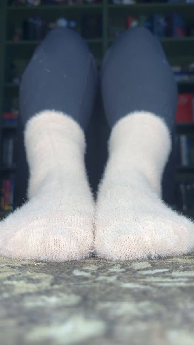 Eyes where they belong… right on my fuzzy socks. 🧦😏
